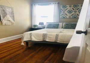 a bedroom with a bed and a window at NYC — Newark Airport with Office! in Newark