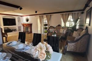 a living room with a table with flowers on it at Luxstay in Huntington Beach in Huntington Beach