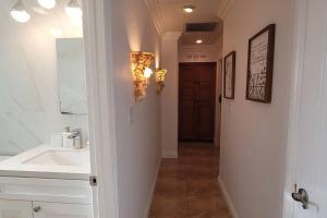 a bathroom with a sink and a mirror at Luxstay in Huntington Beach in Huntington Beach +51 photos