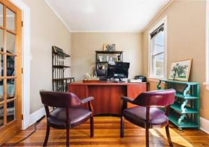 a home office with two chairs and a desk at NYC — Newark Airport with Office! in Newark