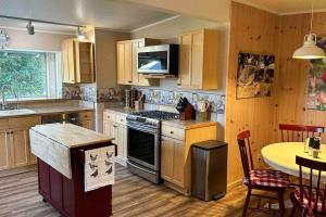 a kitchen with a sink and a stove top oven at Julian Orchard Ranch in Santa Ysabel