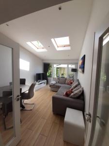 a living room with a couch and a desk at Inse House Laytown in Laytown