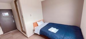 Postel nebo postele na pokoji v ubytování World Business Hotel