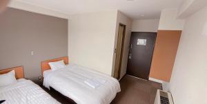 Postel nebo postele na pokoji v ubytování World Business Hotel