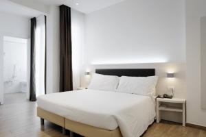 Postel nebo postele na pokoji v ubytování Hotel Cantoria