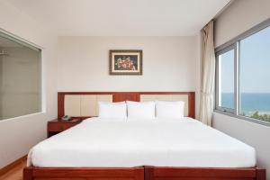 Postelja oz. postelje v sobi nastanitve Sekong Hotel Da Nang