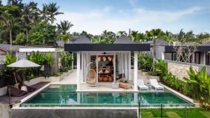 an exterior view of a villa with a swimming pool at Villa Paso by BaliSuperHost in Ubud +33 photos