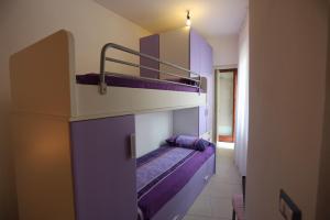 a couple of bunk beds in a room at La casa di Anna in Fluminimaggiore