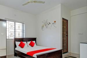 מיטה או מיטות בחדר ב-Flagship Gokul Residency