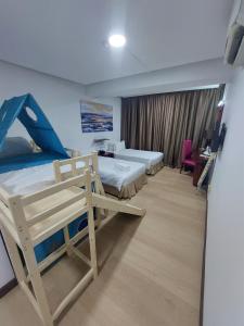 Postel nebo postele na pokoji v ubytování Celyn City Hotel