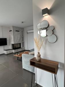 a living room with a couch and a table at Koroni Luxury Maisonette in Koroni