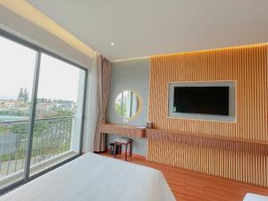 TV a/nebo společenská místnost v ubytování Sunflower Hotel & Resort