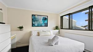 a bedroom with a bed and a window at Lawlers 30 in Mount Hotham