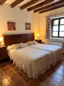Postel nebo postele na pokoji v ubytování Posada Caborredondo