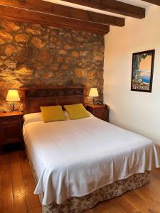 Postel nebo postele na pokoji v ubytování Posada Caborredondo