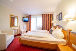 Letto o letti in una camera di Hotel Alpenblick