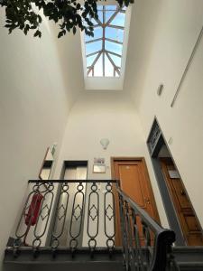 a staircase with a skylight and two doors at Hotel Leopolda in Florence