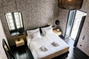 Cama ou camas em um quarto em She Mykonos - The Residency
