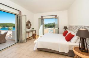 アギオス・ステファノスにあるVilla Georgiaのベッドルーム1室(ベッド1台付)が備わります。