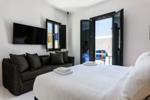 Cama ou camas em um quarto em She Mykonos - The Residency