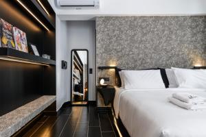 Cama ou camas em um quarto em She Mykonos - The Residency