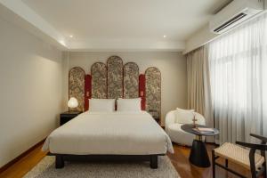 Postel nebo postele na pokoji v ubytování The 3sis Hotel