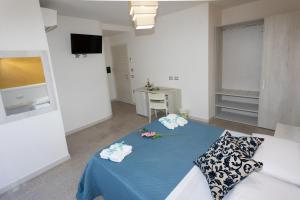 A bed or beds in a room at B&B L'Oasi