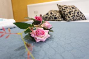 A bed or beds in a room at B&B L'Oasi