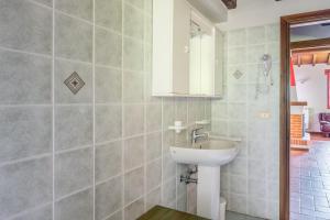 a bathroom with a sink and a mirror at Il Serrino 5 in Pistoia +28 photos