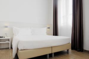 Postel nebo postele na pokoji v ubytování Hotel Cantoria