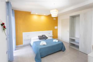 A bed or beds in a room at B&B L'Oasi