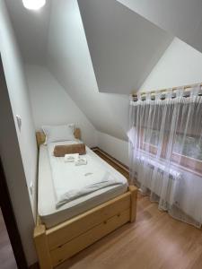 Postel nebo postele na pokoji v ubytování Vila Perisic
