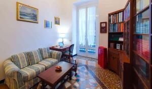 a living room with a couch and a table at La Casa dell'Arte - The House of Art in Genova
