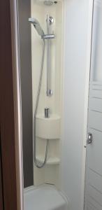 a bathroom with a shower and a sink at Camper Relax in Murter Slanica beach - with clima in Tisno