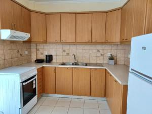 Η κουζίνα ή μικρή κουζίνα στο GnA Place - Stylish and Cozy Apartment in the Heart of the City By Villa Mana Gers