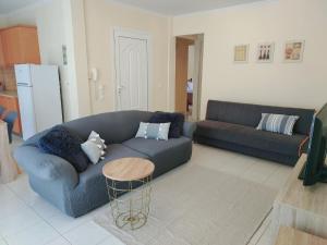 Χώρος καθιστικού στο GnA Place - Stylish and Cozy Apartment in the Heart of the City By Villa Mana Gers