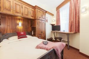 Postel nebo postele na pokoji v ubytování Le Petit CHARME-INN