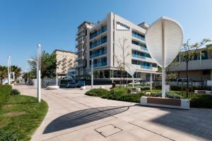 a large building with a large satellite at Hotel Sporting Riccione in Riccione