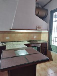 a kitchen with a stove and a counter top at casa señorial Sara in Trigueros