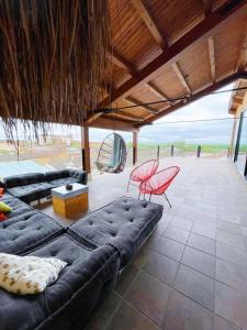 a living room with a couch and a table and chairs at Casa Rural Vereda - Fábrica de Cerveza in Ledigos