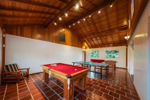 a room with two ping pong tables in it at Pousada Betânia in Gramado