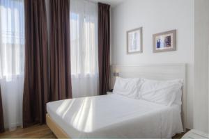 Postel nebo postele na pokoji v ubytování Hotel Cantoria