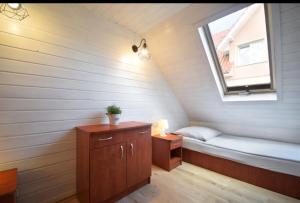 Postel nebo postele na pokoji v ubytování STECYK - DOMKI NAD MORZEM, Pustkowo