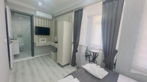 a hotel room with a bed and a bathroom at La Mer Old City Hotel in Istanbul