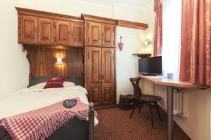 Postel nebo postele na pokoji v ubytování Le Petit CHARME-INN