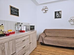 a bedroom with a bed and a counter with a microwave at La Ca' Bianca Affittaly Rooms in Castenaso