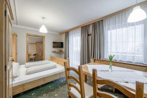 Postel nebo postele na pokoji v ubytování Landhaus Edelweiss