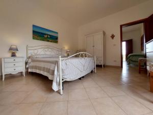 En eller flere senge i et værelse på Appartamento con vista mare