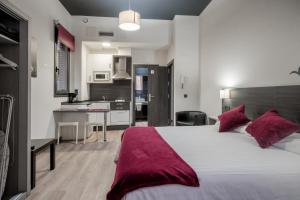 Postel nebo postele na pokoji v ubytování Apartamentos Capua