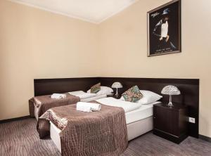 Postel nebo postele na pokoji v ubytování Hotel Willa Adriana